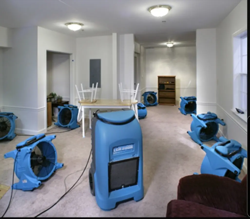 Air movers and dehumidifier setup for Water Damage Restoration in Holly